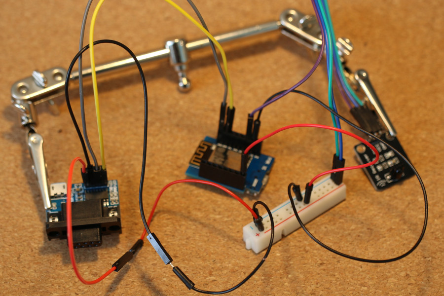 An ESP8266 wired up to an infrared receiver module and RS-232 to TTL UART converter module